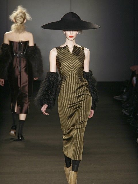 Clothing, Fashion show, Human body, Hat, Dress, Shoulder, Joint, Runway, Waist, Style, 