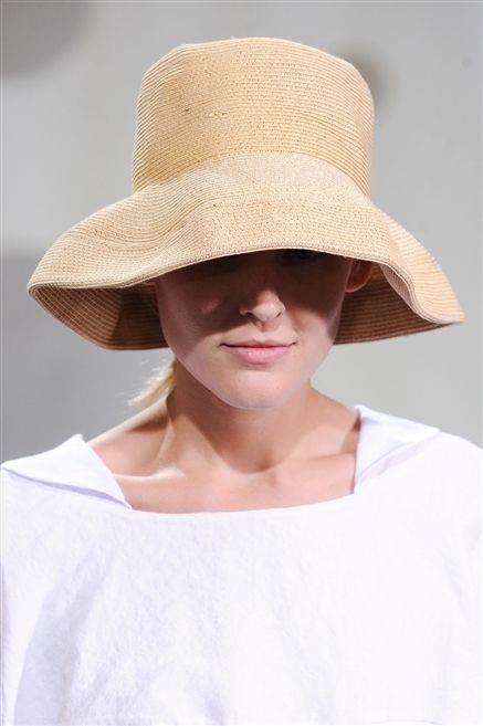 Clothing, Hat, Lip, Brown, Skin, Sleeve, Chin, Shoulder, Joint, Sun hat, 