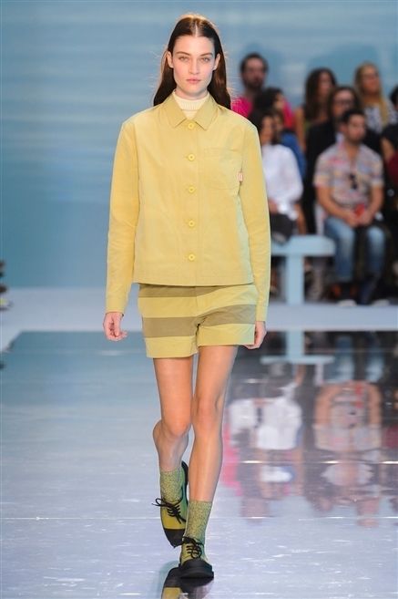 Yellow, Sleeve, Fashion show, Human body, Human leg, Shoulder, Joint, Outerwear, Runway, Style, 