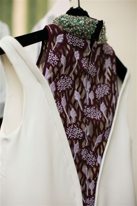 Brown, Textile, Purple, Fashion, Pattern, Embellishment, Maroon, Clothes hanger, Mannequin, One-piece garment, 
