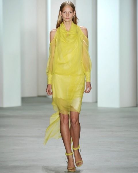 Yellow, Fashion show, Shoulder, Joint, Human leg, Runway, Style, Waist, Fashion model, One-piece garment, 