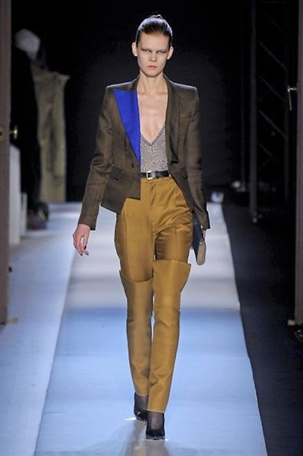 Clothing, Leg, Brown, Sleeve, Human body, Fashion show, Shoulder, Textile, Collar, Joint, 