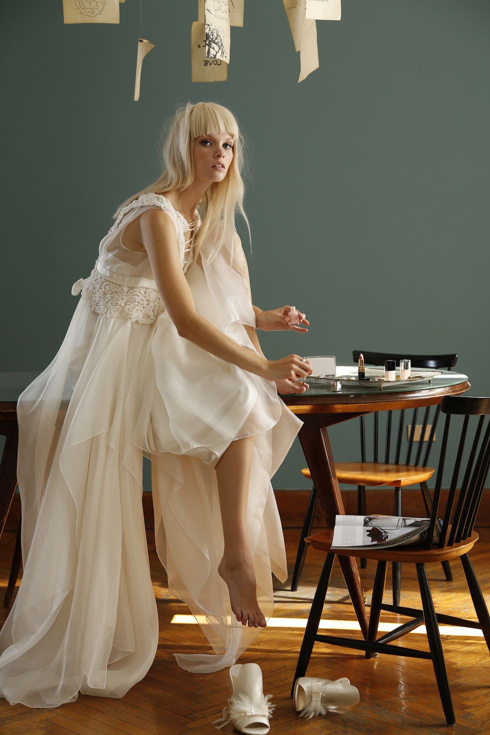 Dress, Sitting, Gown, Long hair, Kitchen & dining room table, Wood flooring, Blond, High heels, Embellishment, Model, 