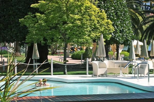 Plant, Swimming pool, Property, Real estate, Outdoor furniture, Resort, Shade, Garden, Water feature, Sunlounger, 