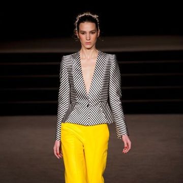 Clothing, Yellow, Sleeve, Human body, Trousers, Fashion show, Shoulder, Joint, Outerwear, Style, 