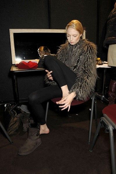 Furniture, Sitting, Fur, Picture frame, Blond, Natural material, Tights, Animal product, Fur clothing, Fashion design, 