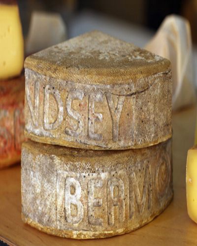 Cylinder, Natural material, Cheese, Still life photography, Parmigiano-reggiano, Brass, Artifact, 