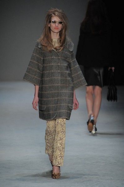 Clothing, Footwear, Fashion show, Brown, Sleeve, Human body, Shoulder, Runway, Textile, Joint, 