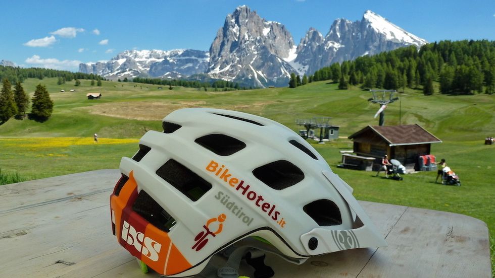 Mountainous landforms, Mountain range, Helmet, Highland, Natural landscape, Landscape, Bicycle helmet, Sports gear, Personal protective equipment, Plain, 
