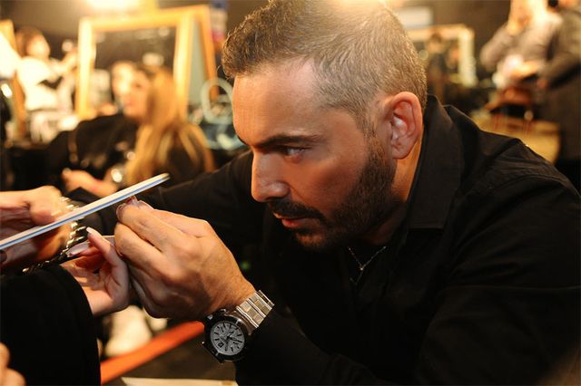 Eyebrow, Watch, Wrist, Facial hair, Beard, Nail, Mobile phone, Eyelash, Cosmetics, Analog watch, 