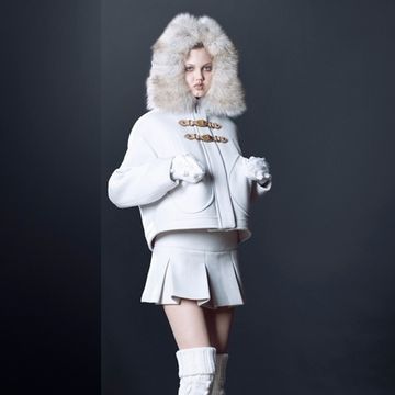 Clothing, Sleeve, Textile, Standing, Style, Fur clothing, Knee, Fashion, Jacket, Natural material, 