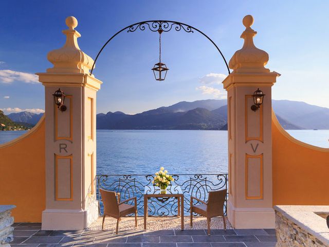Sky, Azure, Finial, Outdoor furniture, Arch, Outdoor table, Lake district, Bell tower, Resort town, Patio, 