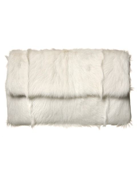 Textile, Khaki, Natural material, Beige, Fur, Cushion, Couch, Fur clothing, Animal product, Throw pillow, 