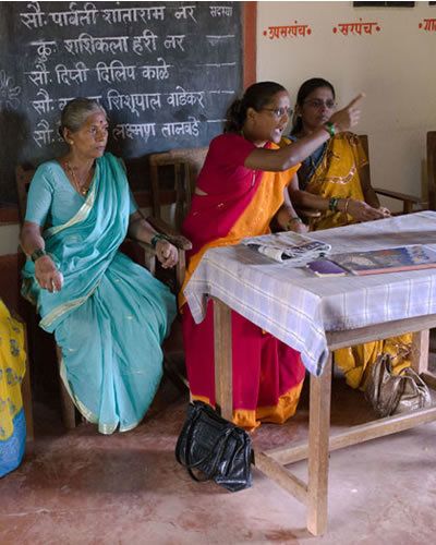 Sitting, Blackboard, Temple, Folk instrument, Chalk, String instrument, Sari, Handwriting, Bangle, Backpack, 