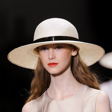 Clothing, Hat, Lip, Hairstyle, Skin, Shoulder, Joint, Style, Sun hat, Headgear, 