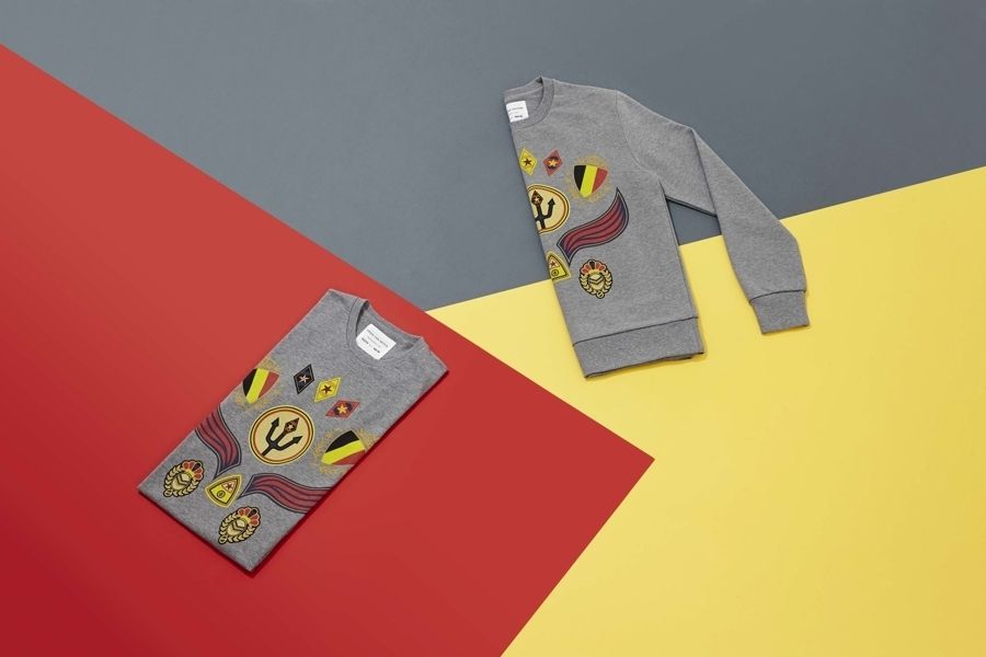 Sleeve, Sweater, Symbol, Active shirt, Emblem, Paper product, 
