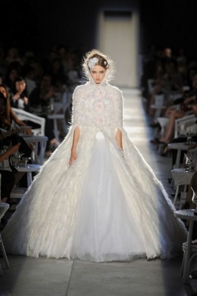 Textile, Dress, Bridal clothing, Gown, Wedding dress, Fashion, Fashion model, Bride, Runway, Costume design, 