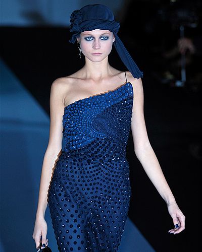 Blue, Dress, Shoulder, Joint, One-piece garment, Electric blue, Hat, Fashion model, Waist, Headgear, 