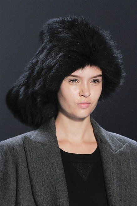 Hairstyle, Textile, Black hair, Headgear, Blazer, Costume accessory, Fur clothing, Fashion, Natural material, Animal product, 