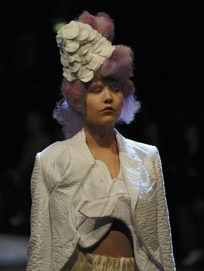 Style, Headgear, Hair accessory, Fashion, Headpiece, Costume design, Fashion model, Artificial flower, Fashion design, Acting, 