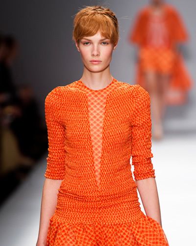Lip, Hairstyle, Sleeve, Shoulder, Red, Joint, Orange, Fashion show, Style, Fashion model, 