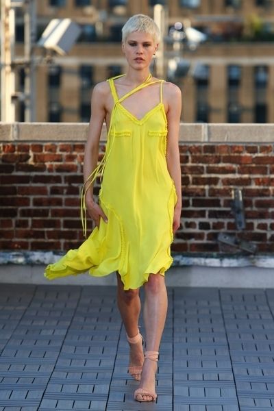 Clothing, Yellow, Dress, Human leg, Shoulder, Joint, One-piece garment, Style, Formal wear, Summer, 