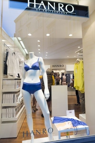 Mannequin, Retail, Logo, Electric blue, Cobalt blue, Chest, Trunk, Display window, Outlet store, Fashion design, 