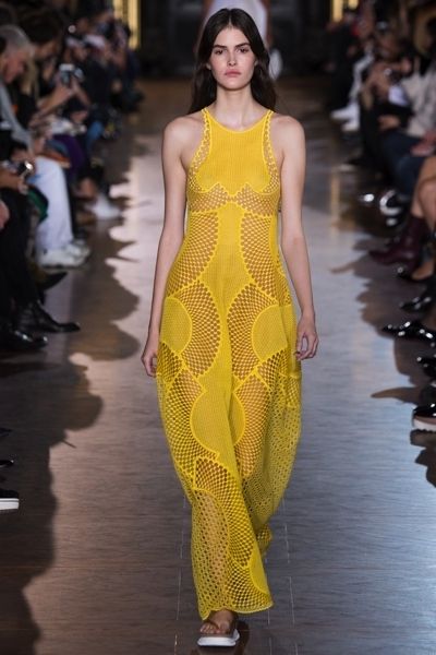 Clothing, Fashion show, Yellow, Shoulder, Runway, Joint, Fashion model, Style, One-piece garment, Dress, 