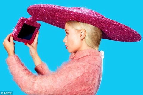 Pink, Magenta, Hat, Headgear, Costume accessory, Gadget, Costume hat, Video game console, Handheld game console, Sun hat, 