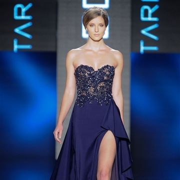 Dress, Shoulder, Joint, Fashion show, Style, Fashion model, One-piece garment, Electric blue, Formal wear, Gown, 