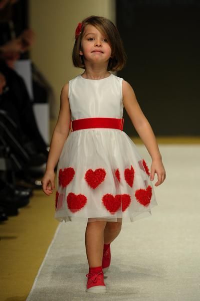 Dress, Shoe, Shoulder, Human leg, Red, Flooring, One-piece garment, Pattern, Fashion, Day dress, 