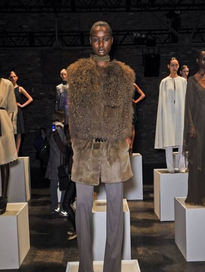 Standing, Sculpture, Fashion, Fur, Natural material, Costume design, Fur clothing, Fashion design, Animal product, Haute couture, 