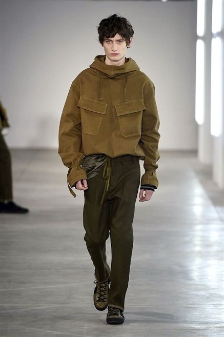Brown, Sleeve, Trousers, Human body, Shoulder, Standing, Joint, Outerwear, Khaki, Fashion show, 