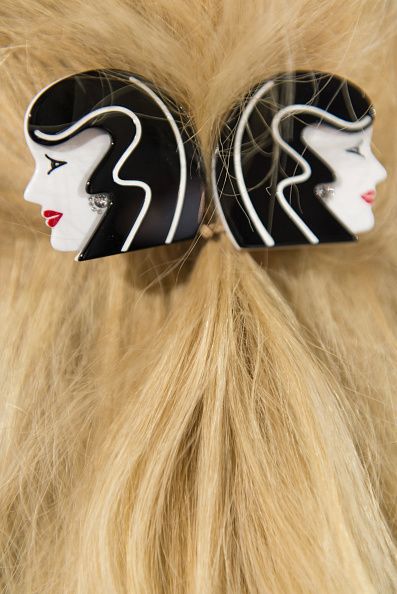 Brown, Hairstyle, Hair accessory, Headgear, Costume accessory, Earrings, Feather, Blond, Tan, Natural material, 
