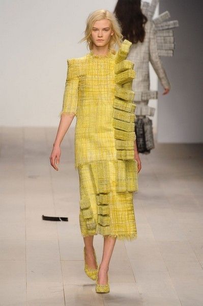 Yellow, Sleeve, Human body, Shoulder, Textile, Joint, Human leg, Style, One-piece garment, Fashion model, 