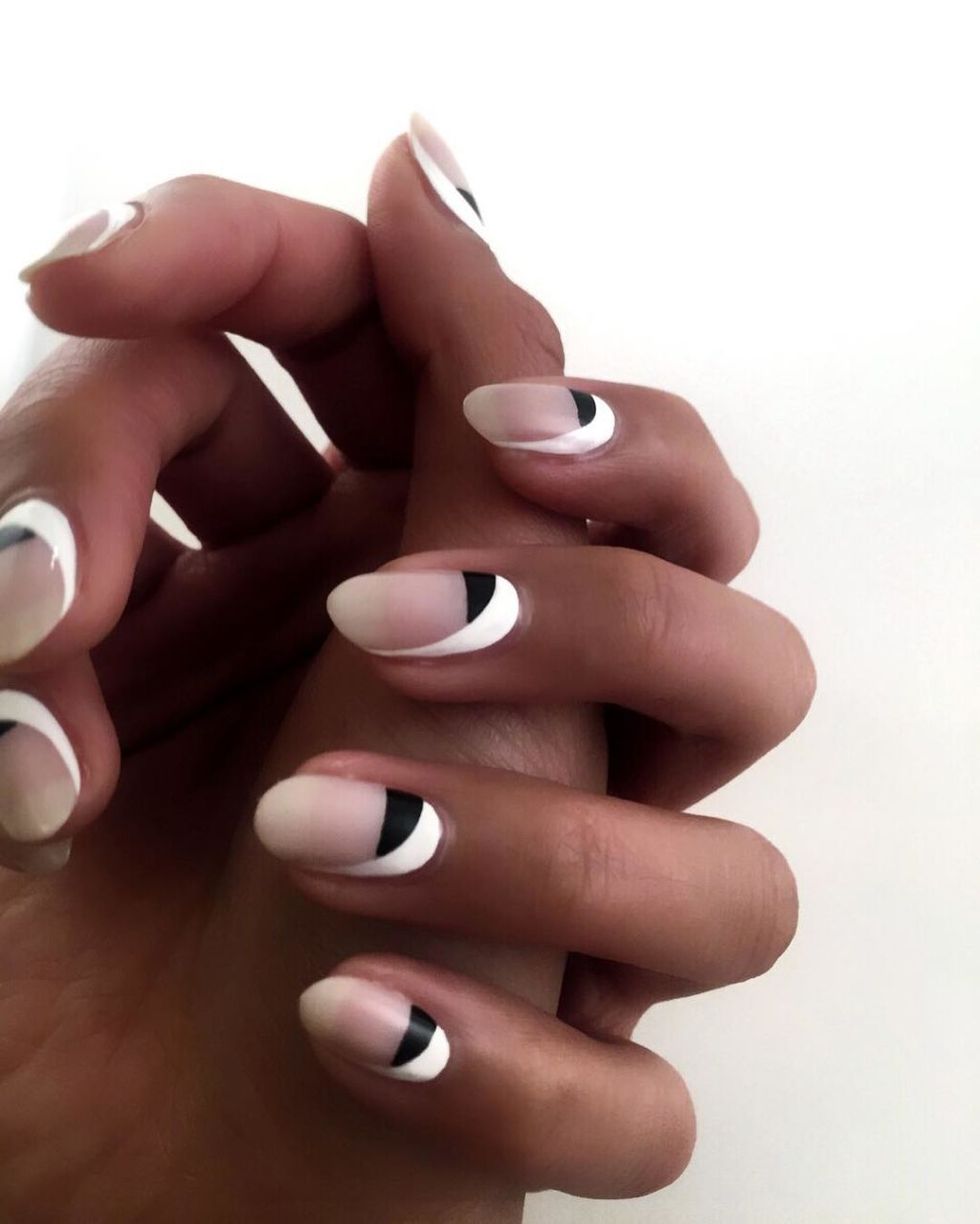<p><span class="redactor-invisible-space" data-verified="redactor" data-redactor-tag="span" data-redactor-class="redactor-invisible-space">Here's another one for negative nail-enthusiasts. Try this monochrome look by painting your half moons black, then add a&nbsp;swooping splash of white to one side of the nail.</span></p><p><em data-redactor-tag="em" data-verified="redactor">Design by&nbsp;</em><a href="https://www.instagram.com/p/BDlaONurUjD/" target="_blank"><em data-redactor-tag="em" data-verified="redactor">@ladyfancynails</em></a></p>