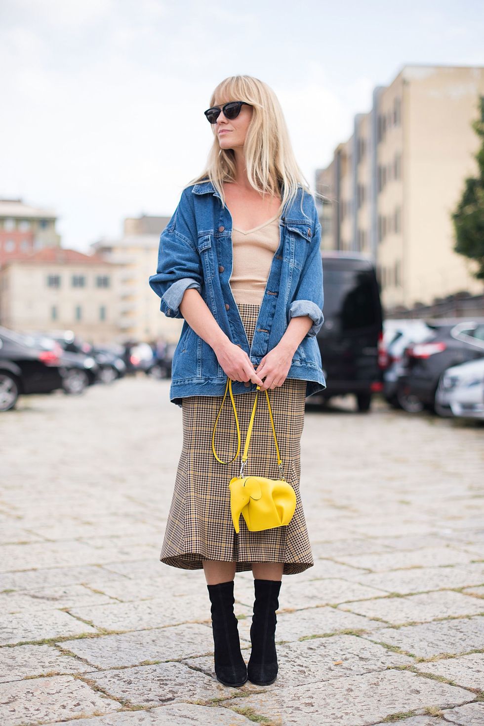 <p>Breathe new life into a classic plaid skirt by adding an oversized denim jacket and whimsical accessory.&nbsp;</p>