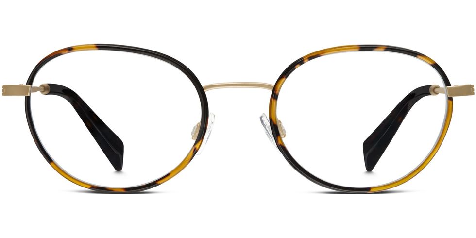 <p>Occhiali in metallo con dettaglio tartarugato, Warby Parker&nbsp;</p>