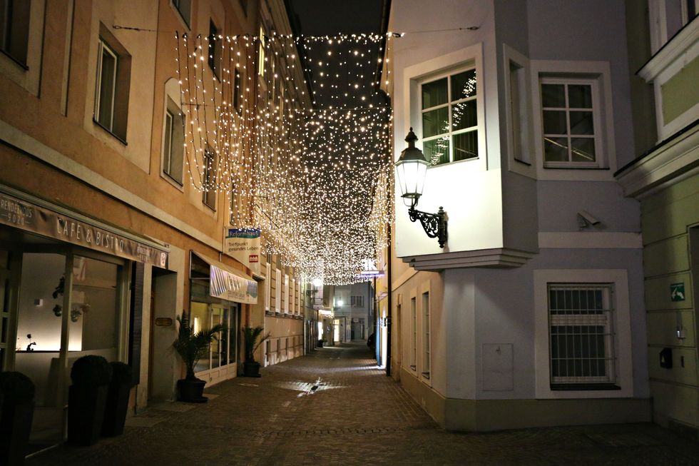 Lighting, Architecture, Facade, Street, Fixture, Alley, Light fixture, Christmas lights, Cobblestone, Midnight, 