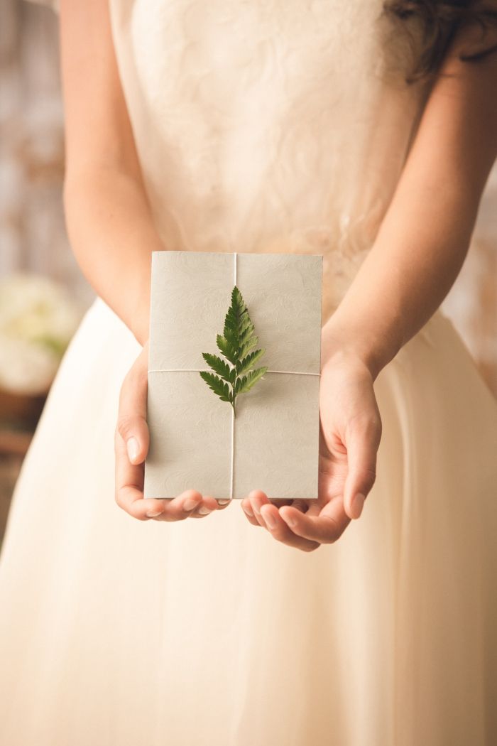 Finger, Leaf, Dress, Bridal clothing, Herb, Wedding dress, Annual plant, Wedding ceremony supply, Gown, Creative arts, 