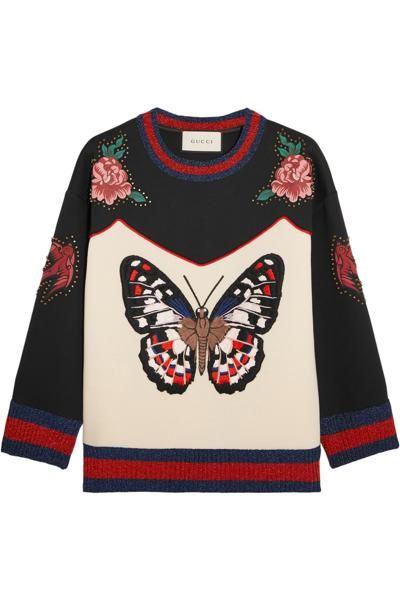 <p>Il pullover con farfalla stampata, Gucci</p>