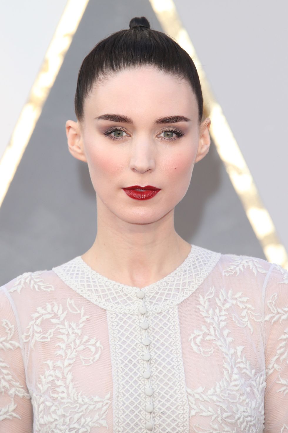 <p>Mara's dark, candy apple lips popped against her delicate dress at the Academy Awards.</p>