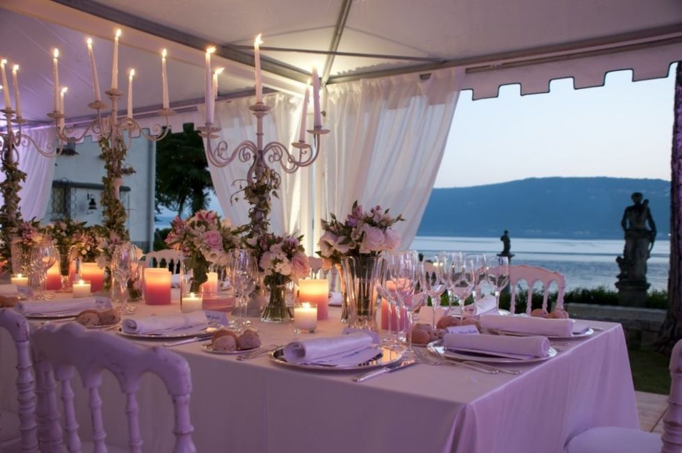 Tablecloth, Lighting, Textile, Decoration, Purple, Table, Linens, Function hall, Furniture, Interior design, 
