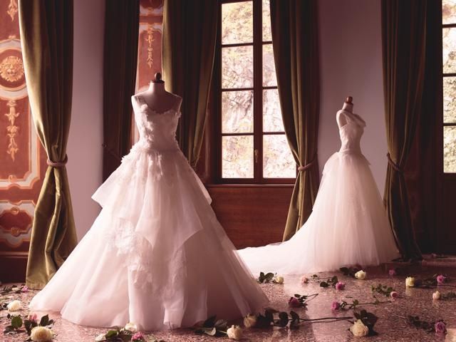 Dress, Interior design, Textile, Bridal clothing, Gown, Wedding dress, Formal wear, Floor, Purple, Window treatment, 