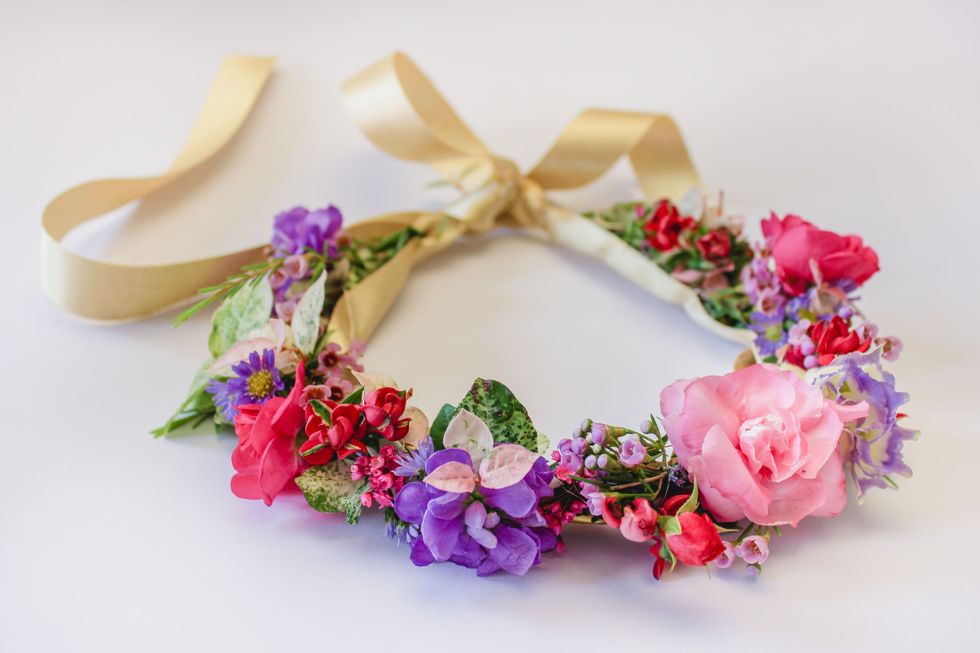 Petal, Pink, Purple, Hair accessory, Costume accessory, Magenta, Violet, Artificial flower, Floral design, Cut flowers, 