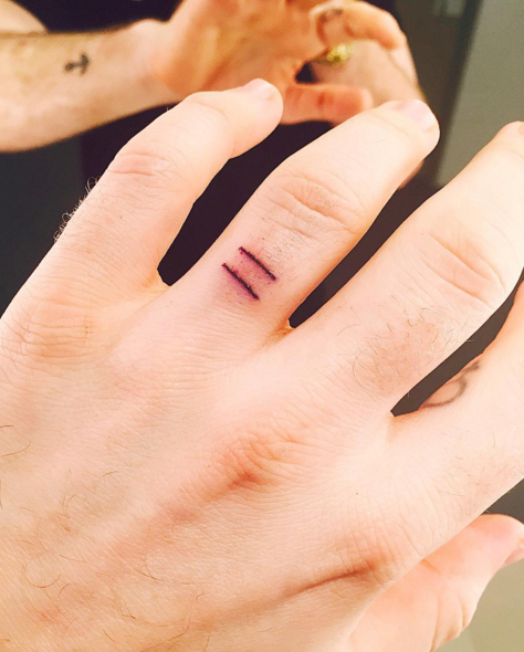 <p>Sam Smith recently got not one, not two, but FOUR new tattoos—all with significant meaning. <a href="https://www.instagram.com/p/_BPkvqR2ZR/?taken-by=samsmithworld" target="_blank">The first</a>, an equality sign inked on his wedding ring finger (shown) is "pretty self explanatory. It shows my views on gay marriage and equality for all." <a href="https://www.instagram.com/p/_BPwdFR2Zh/?taken-by=samsmithworld" target="_blank">The second</a>, a symbol on the inside of his finger, shows one of the first tattoos documented—found on a mummy "found buried alone in the ice." <a href="https://www.instagram.com/p/_BP9box2Z8/?taken-by=samsmithworld" target="_blank">The third</a>, script on his arm that says "honesty" is what Smith promises to be in his music. And <a href="https://www.instagram.com/p/_BQMeVx2aR/?taken-by=samsmithworld" target="_blank">the fourth</a>? "Alone" on his other arm. "This is just me being a melancholy twat haha. I do see it as a small positive thou... No longer lonely... Just alone..."</p>