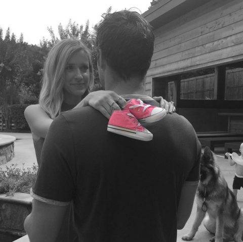 <p>Kristin let the color do the talking, Instagramming this black-and-white photo of her holding a pair of pink shoes. She captioned the shot, "The boys are so excited for a little sister!!!!!!🎀"</p>