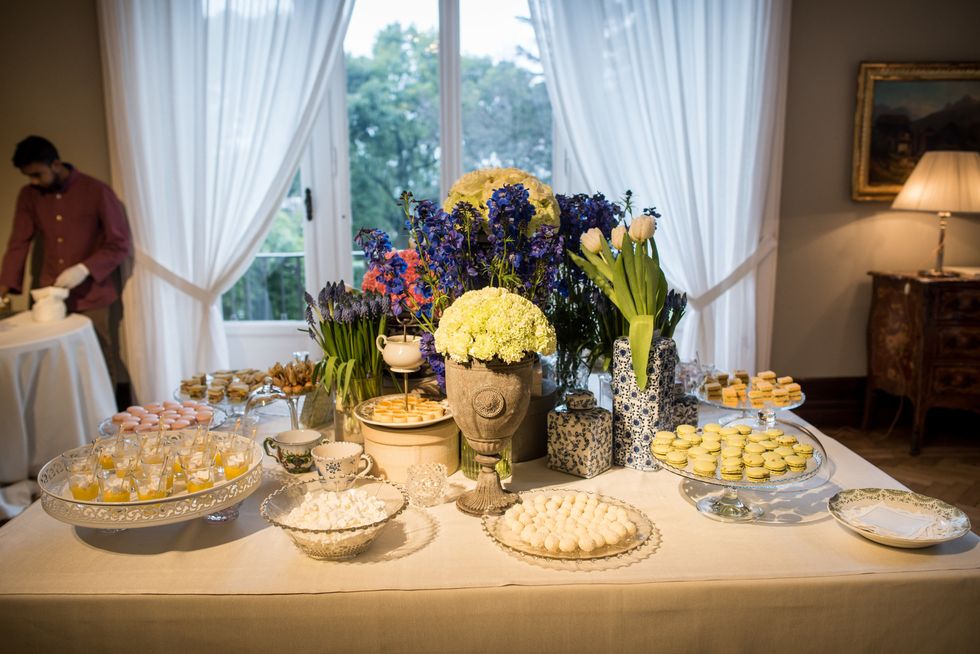 Yellow, Interior design, Tablecloth, Room, Food, Textile, Serveware, Cuisine, Table, Furniture, 