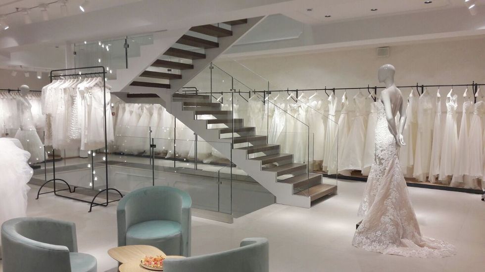 Interior design, Stairs, Floor, Dress, Ceiling, Bridal clothing, Gown, One-piece garment, Light fixture, Ceiling fixture, 