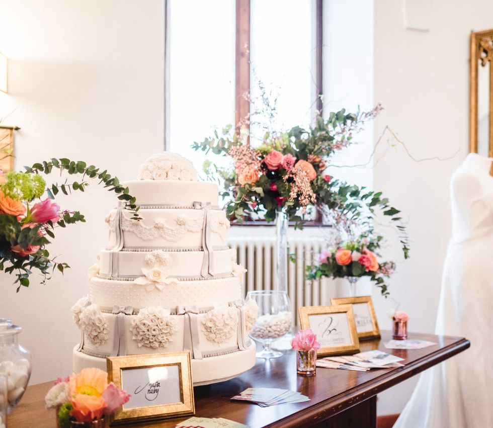 Pink, Wedding cake, Wedding ceremony supply, Yellow, Peach, Cake, Interior design, Room, Flower, Table, 